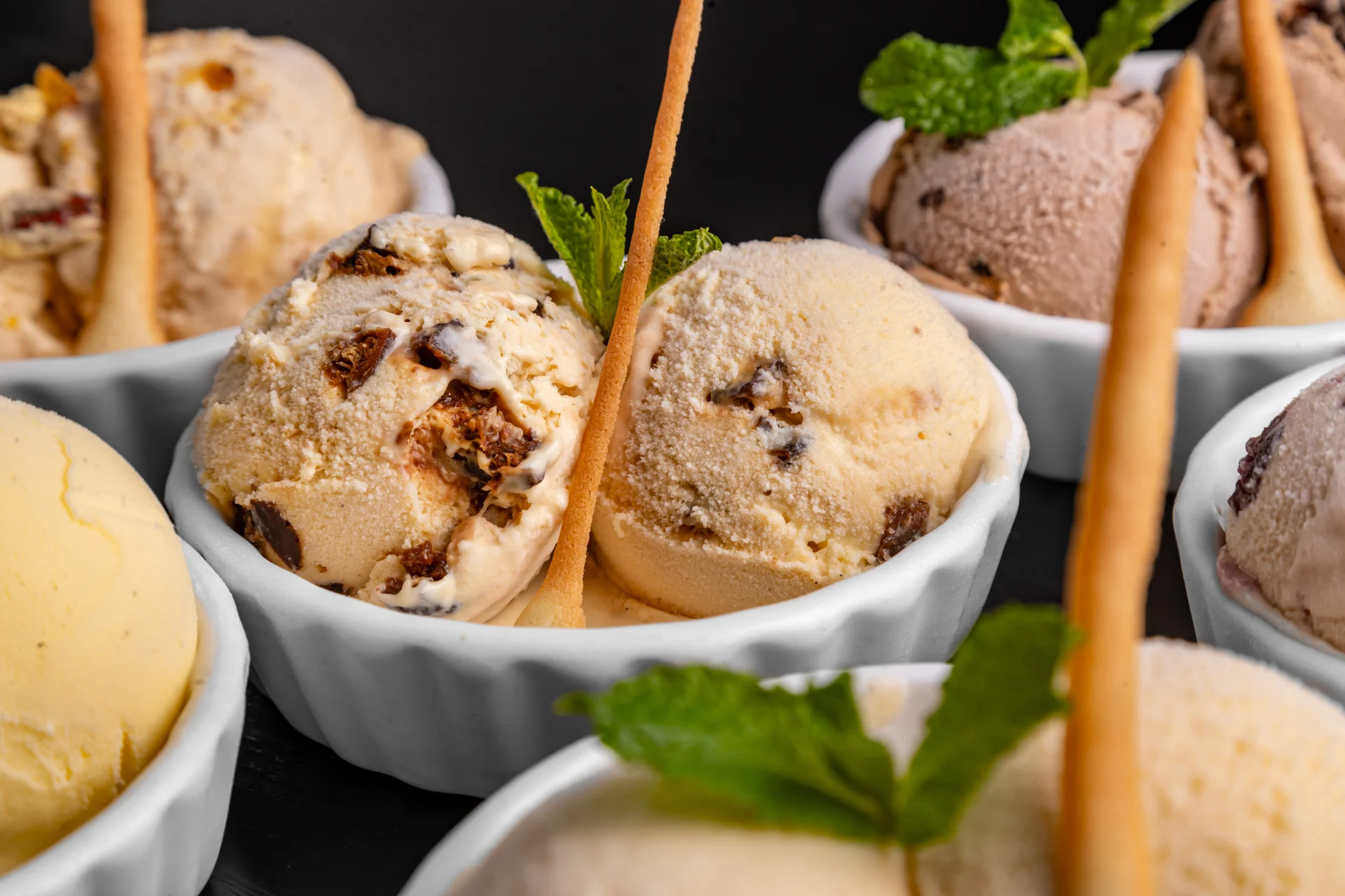 Assorted ice cream scoops in elegant bowls