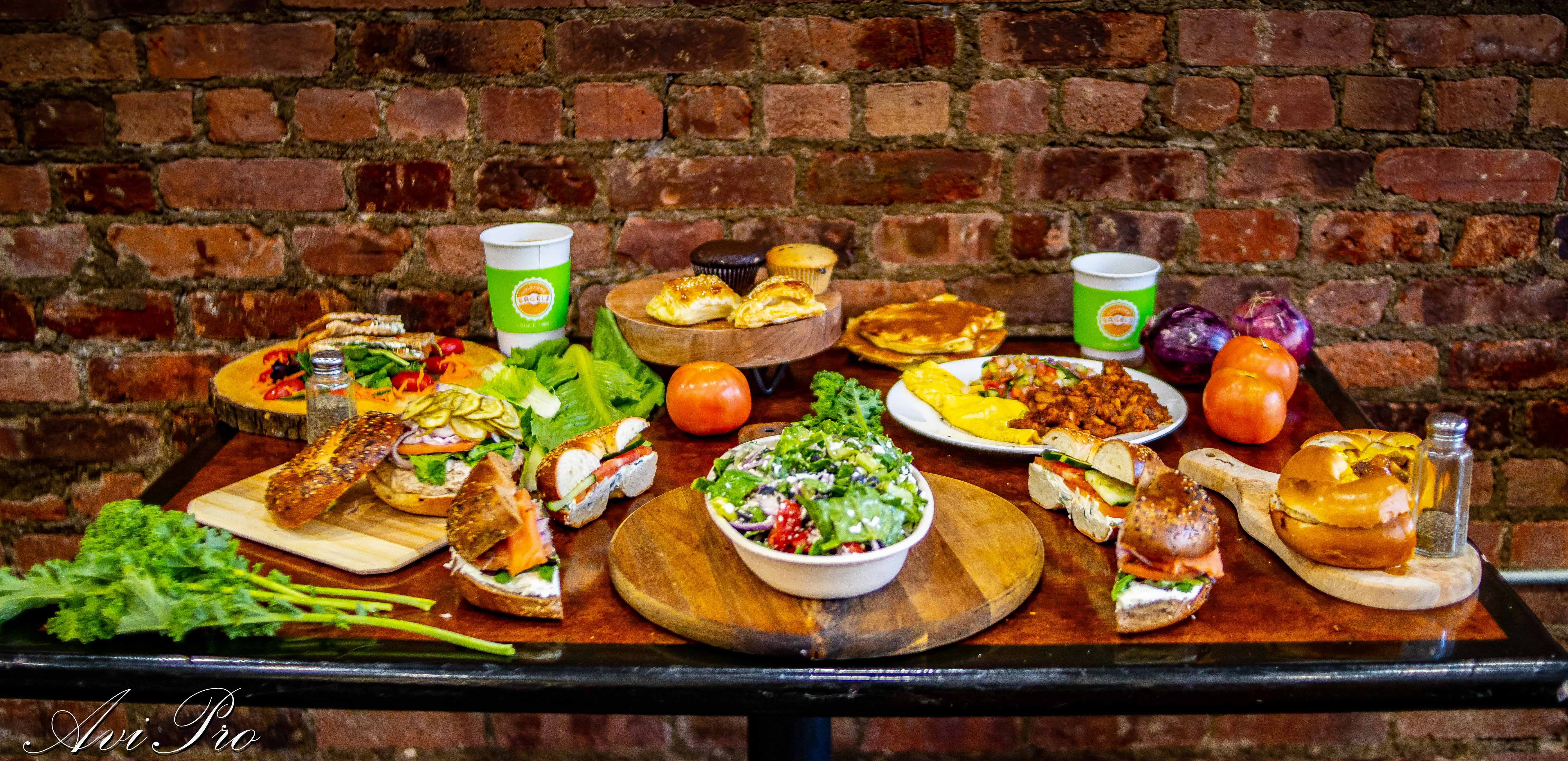 Assorted sandwiches and salads on a rustic table