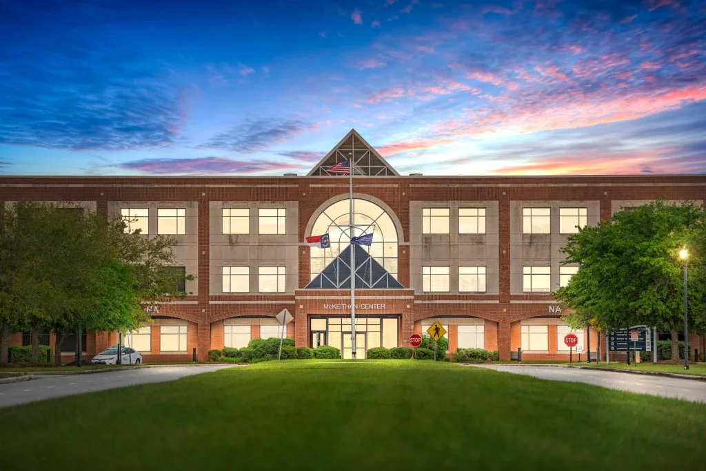 Exterior view of McKeithan Center with modern architecture and landscaping.