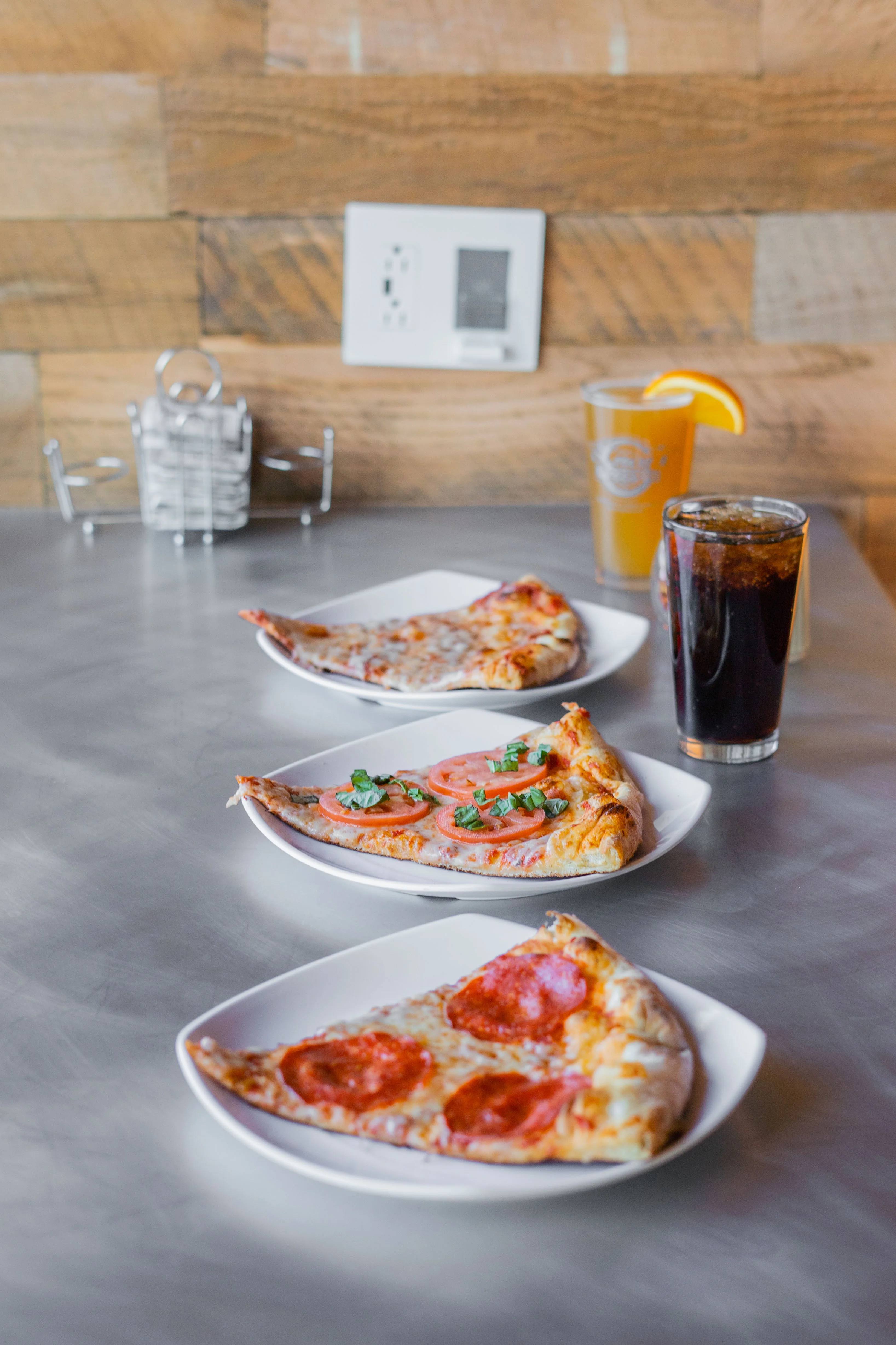 three pizza slices on a table