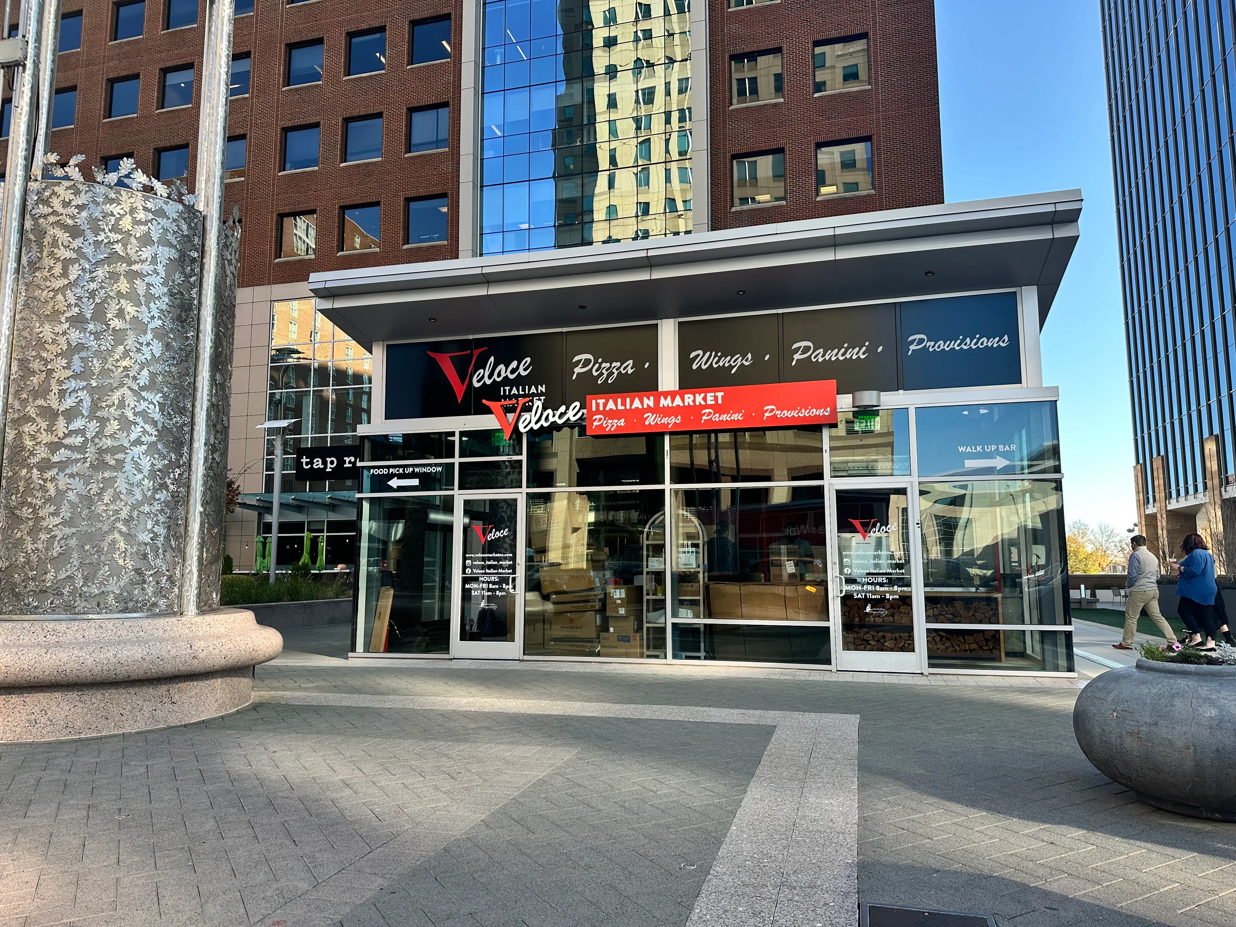 Veloce Italian Market exterior with pizza and panini offerings