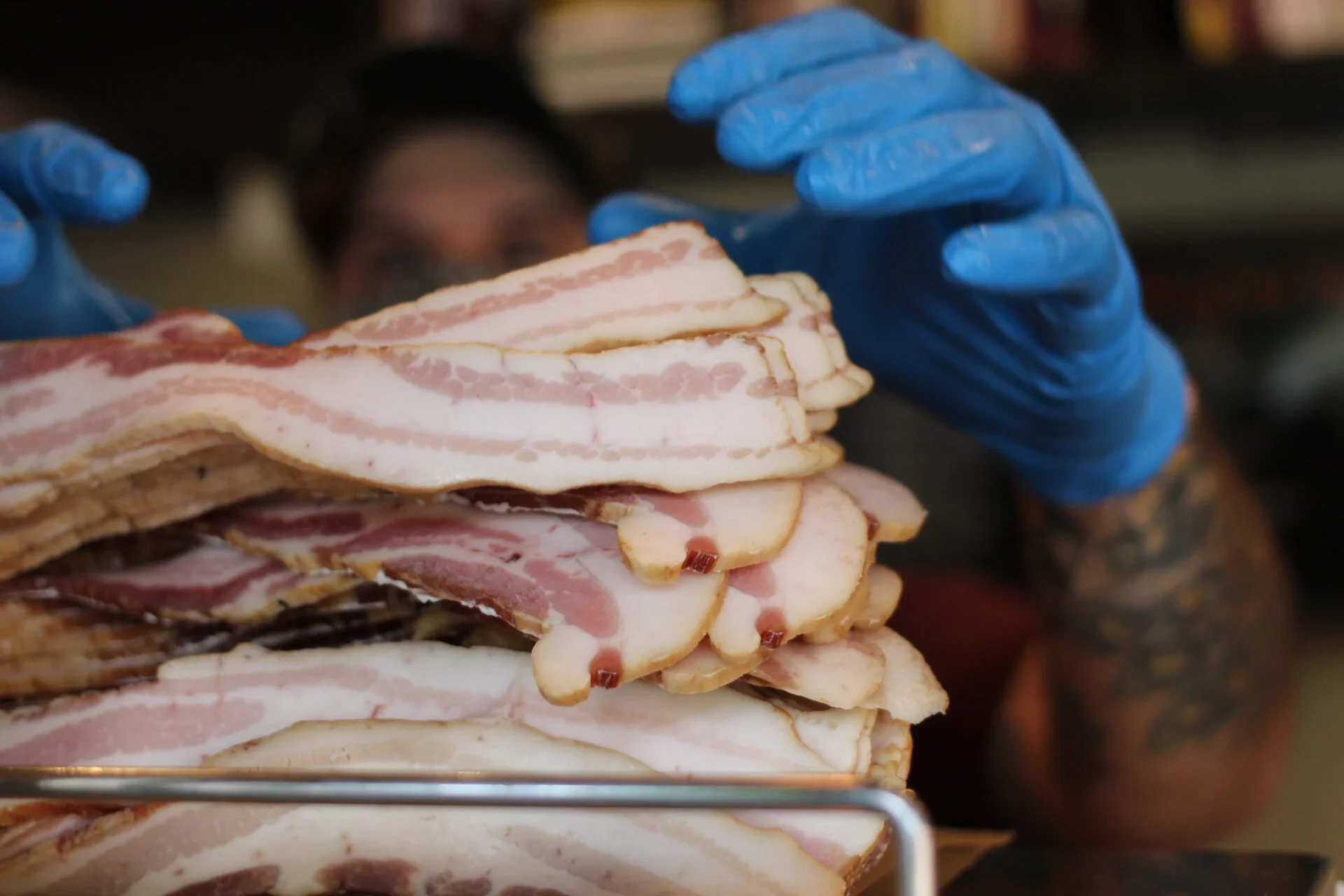 Delicious bacon dish served on a wooden table with fresh ingredients.