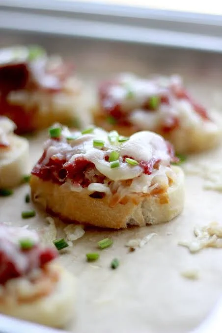 Italian bruschetta topped with tomato and cheese