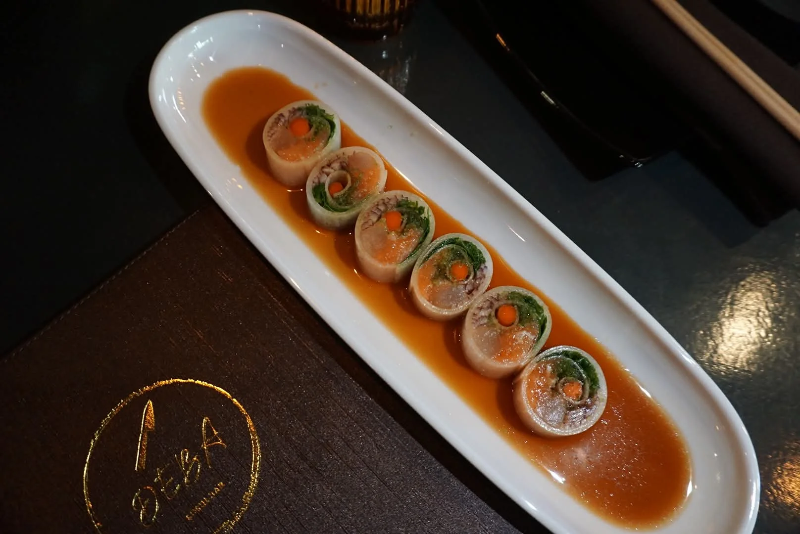 Japanese sushi rolls with fresh vegetables and savory sauce