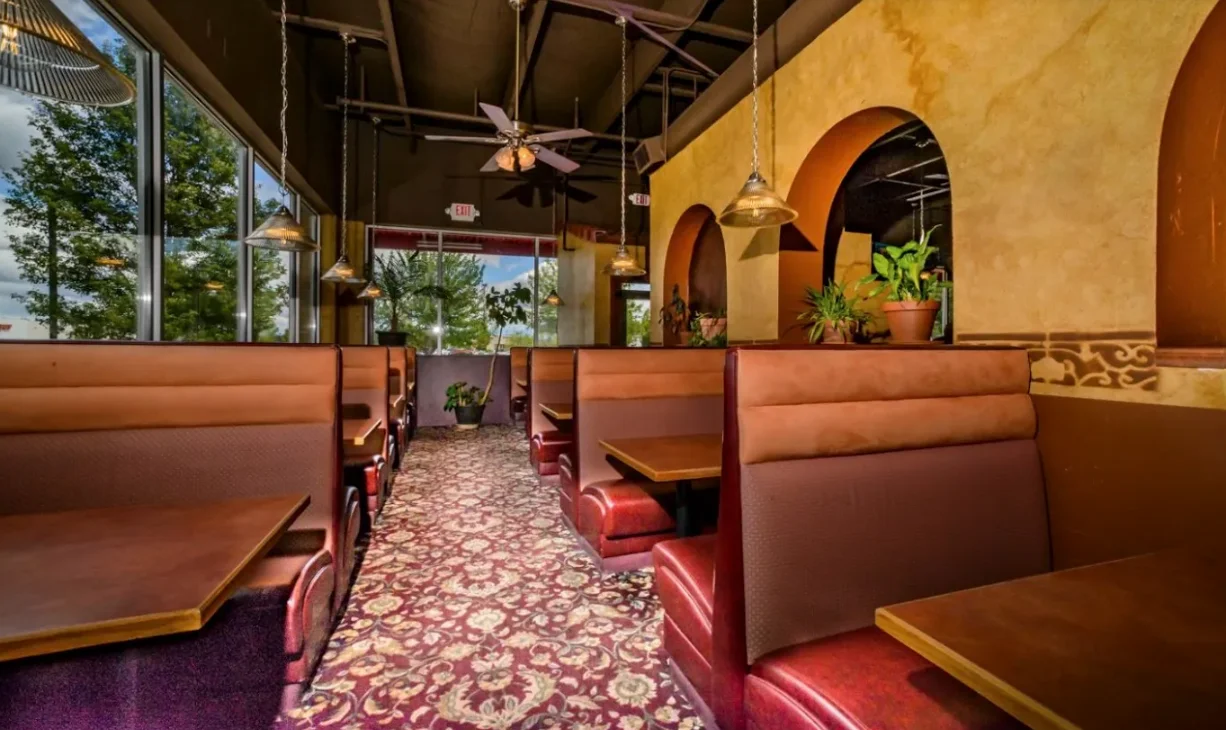 Cozy restaurant interior with booths and natural light
