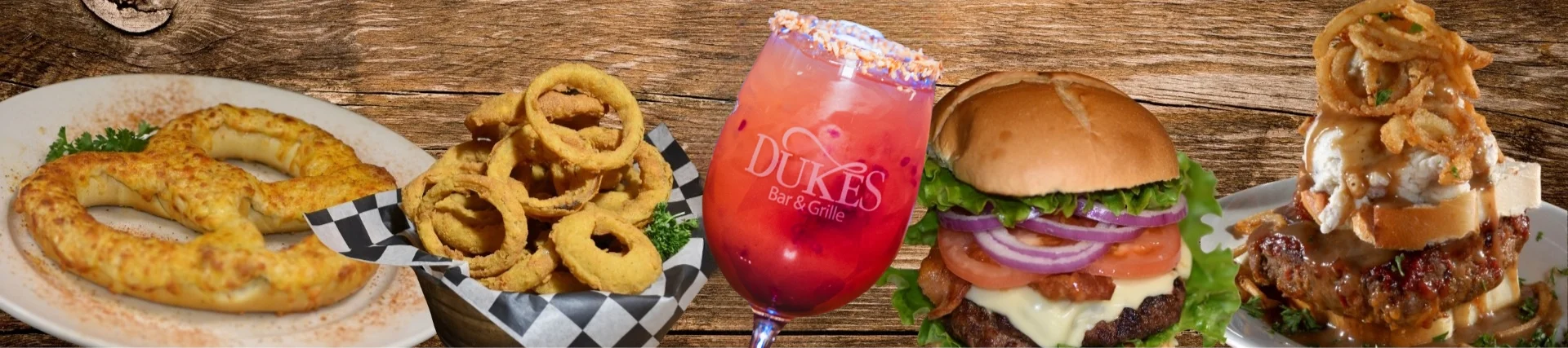 American burger with onion rings and a colorful cocktail
