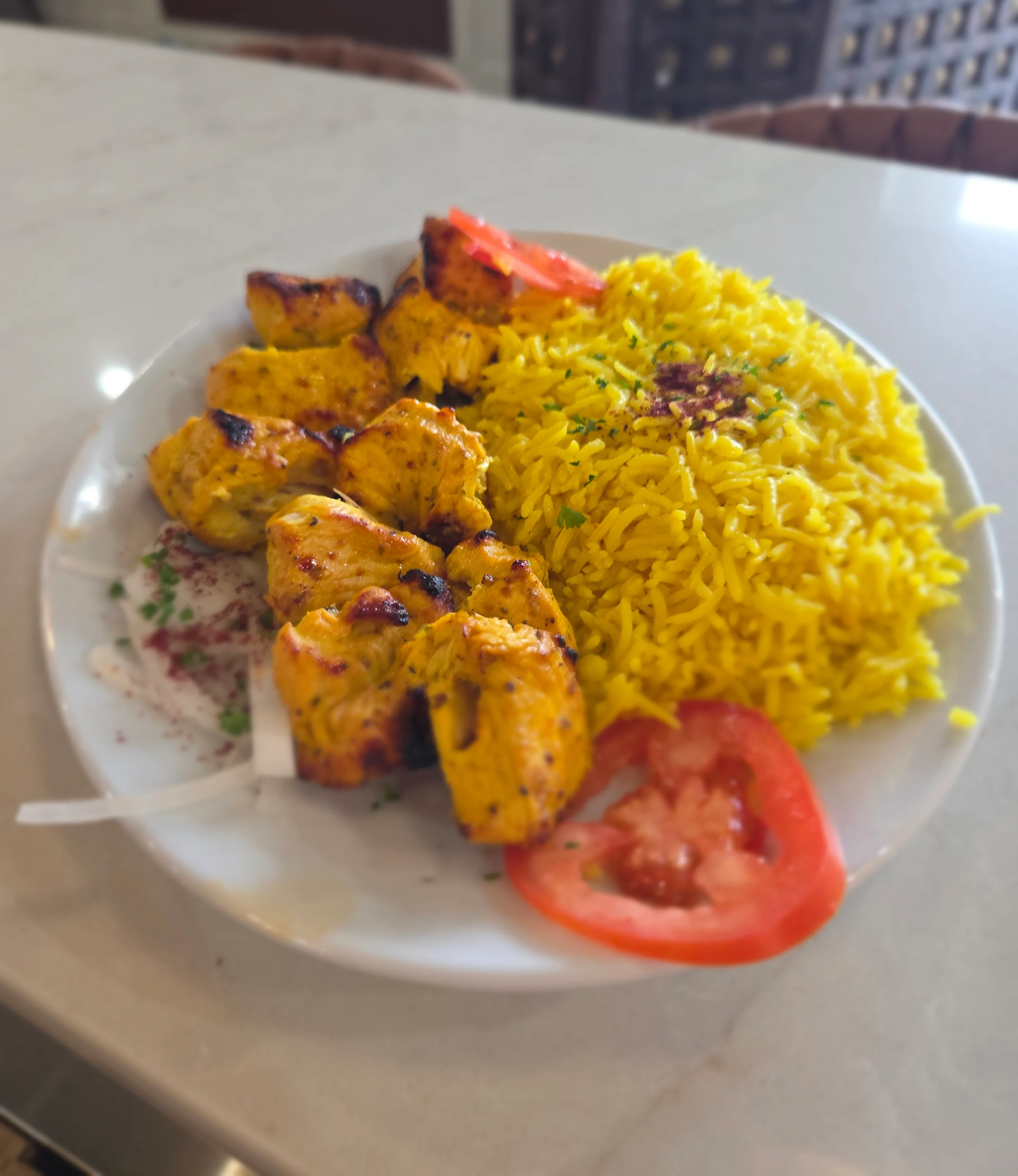 Grilled chicken kebabs with saffron rice