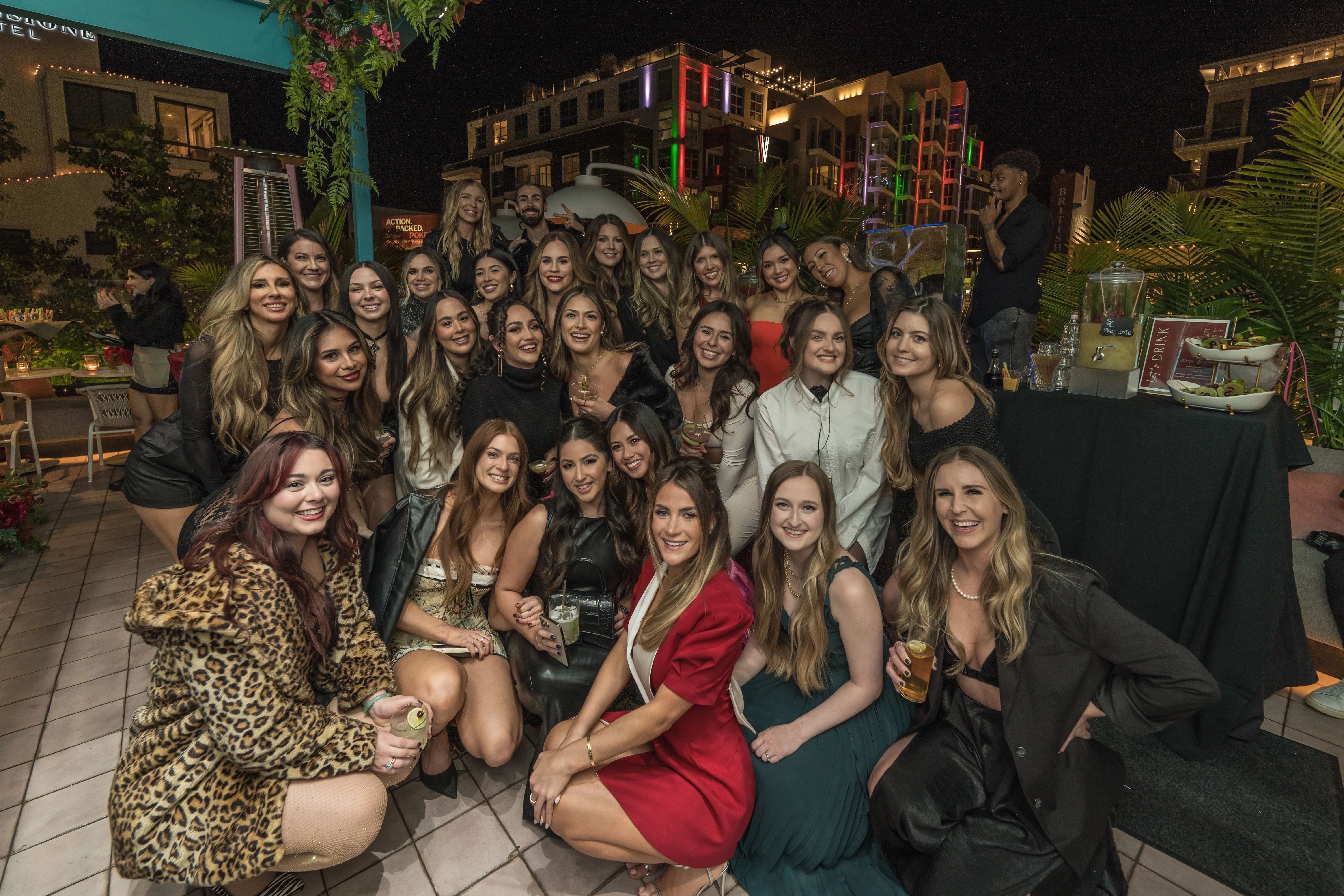 Group of friends celebrating at a vibrant rooftop party