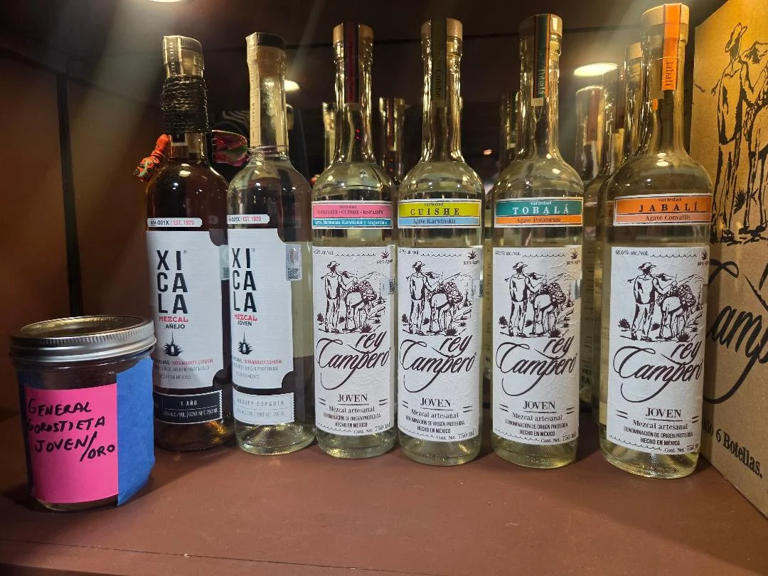 Selection of artisanal mezcal bottles on display