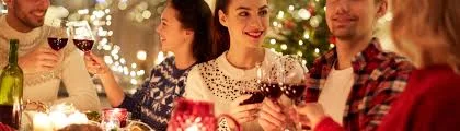 Festive Christmas table setting with decorations and food.