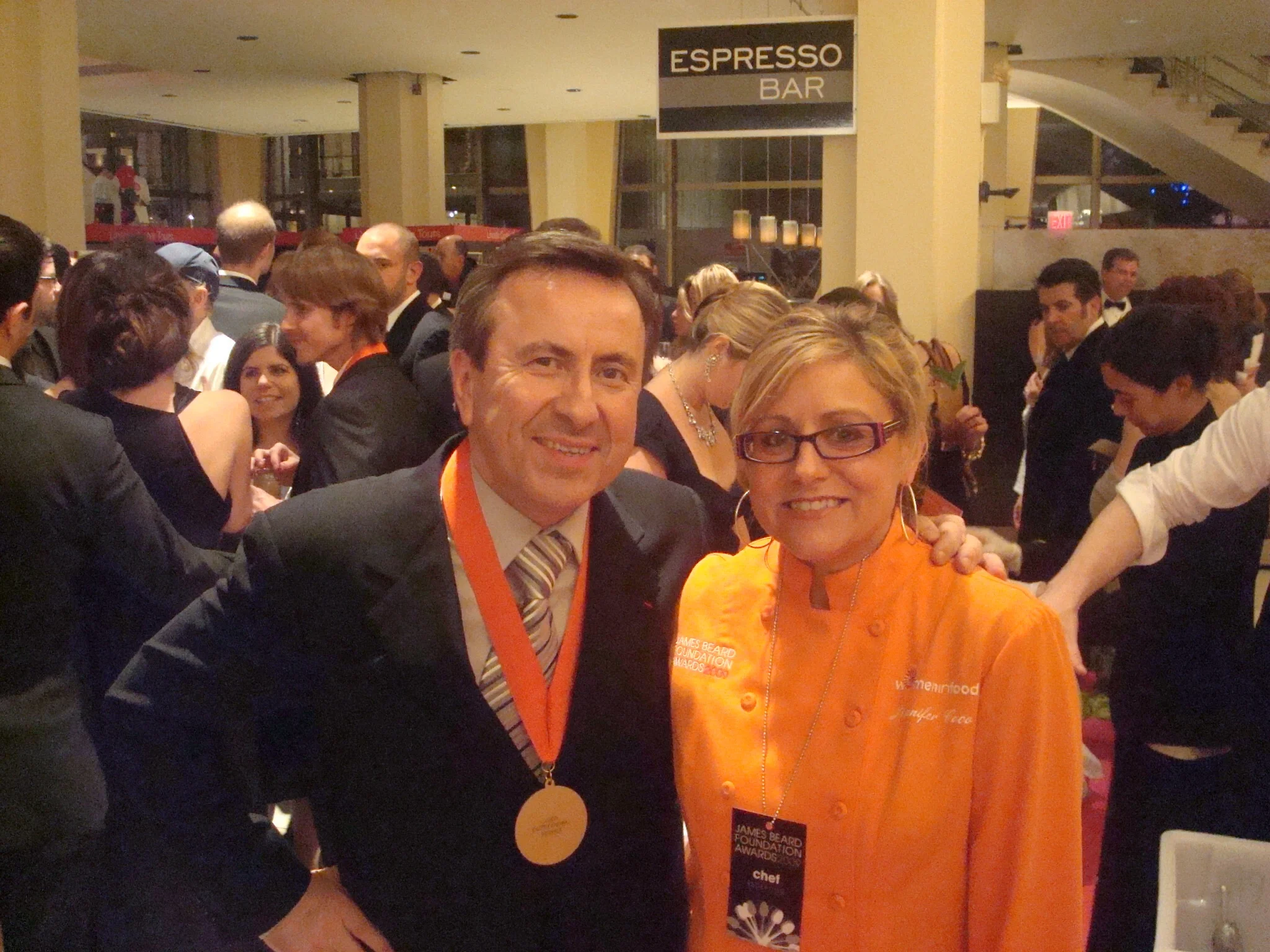 Chefs at a culinary awards event with an espresso bar in the background