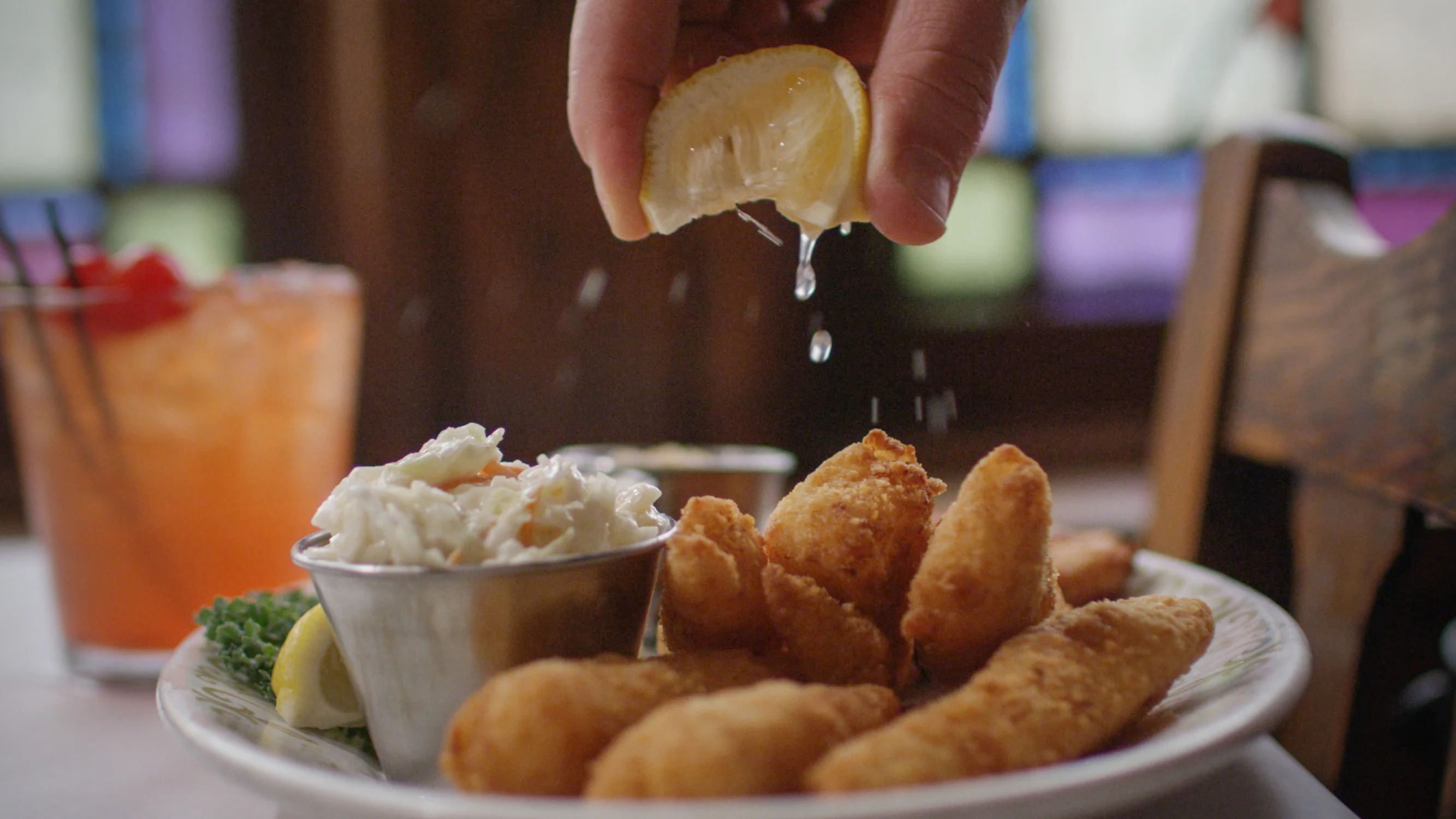 Fried catfish platter with coleslaw and lemon