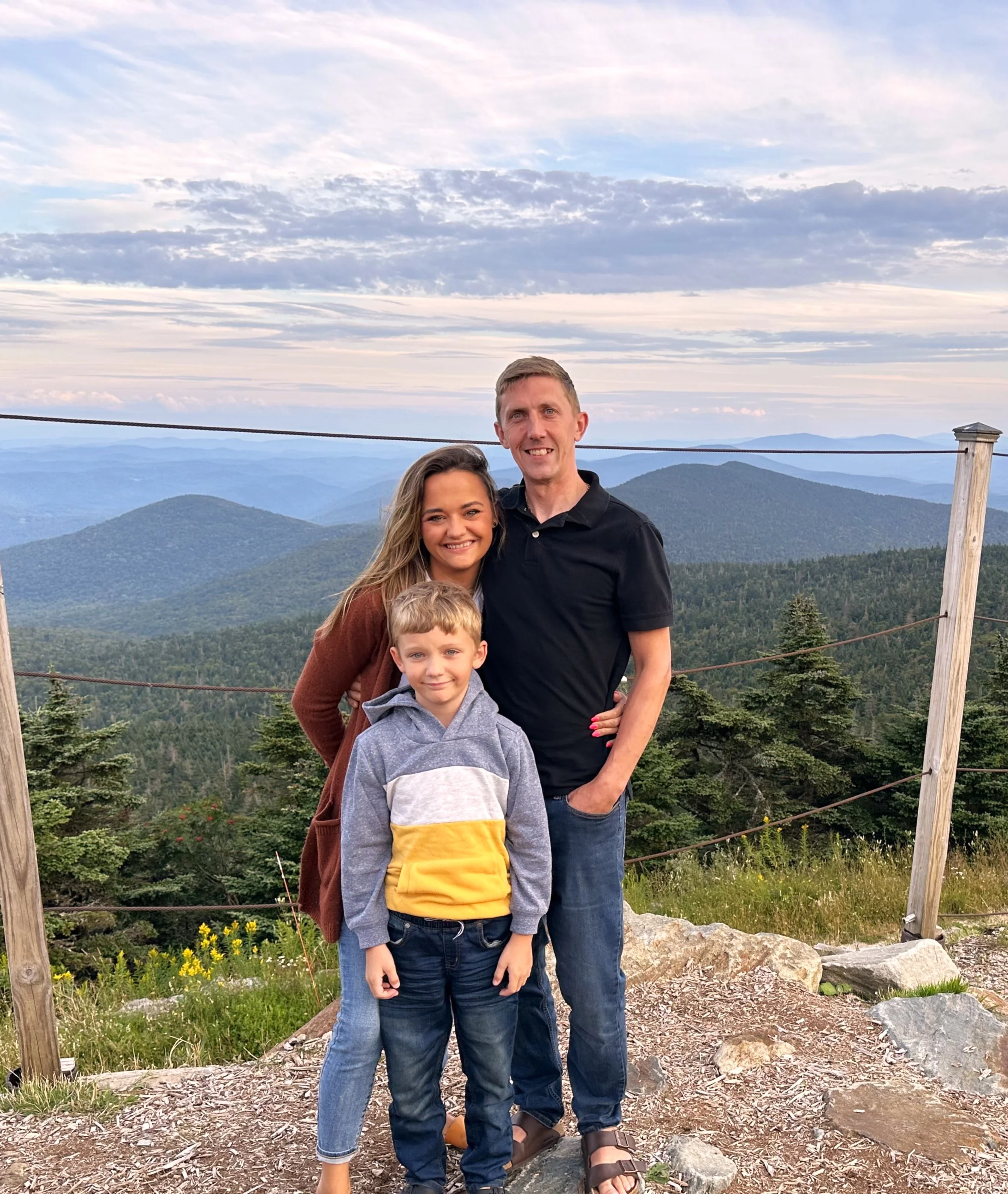 Family portrait with mountain view at sunset