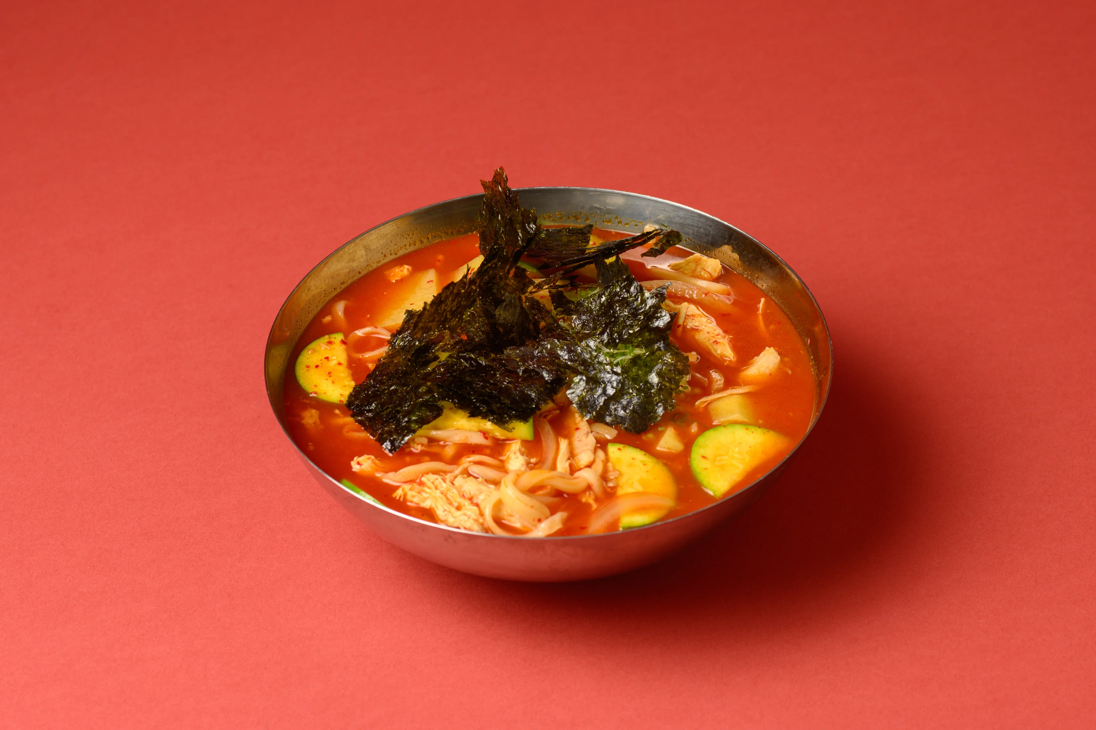 Spicy Korean ramyeon topped with seaweed
