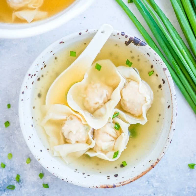Chinese wonton soup with delicate dumplings in broth