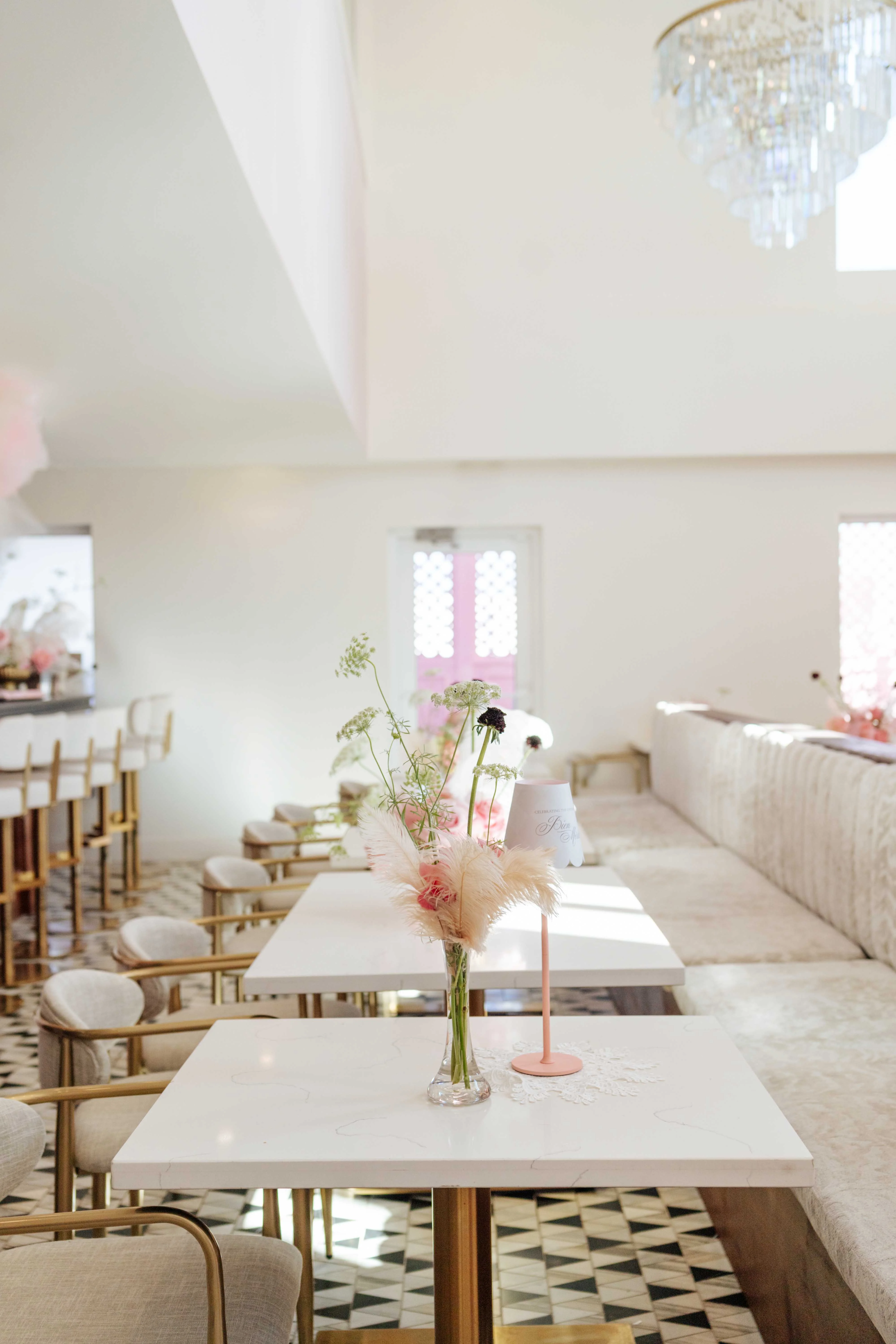 Elegant restaurant interior with floral decor and modern furnishings