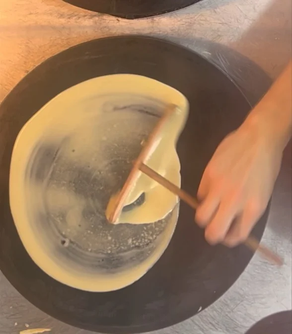 A restaurant chef preparing a dish