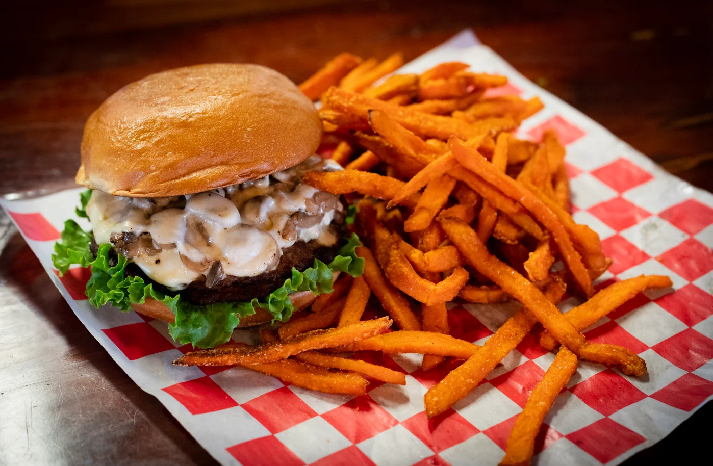 Juicy cheeseburger with sweet potato fries