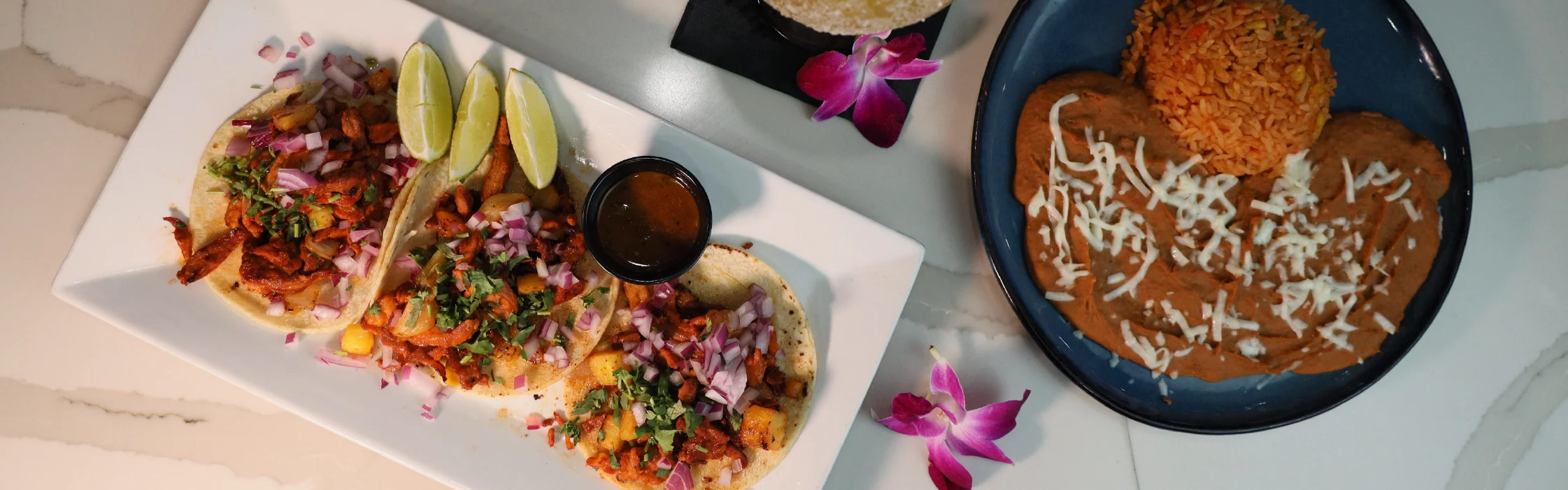 Authentic Mexican tacos with rice and beans