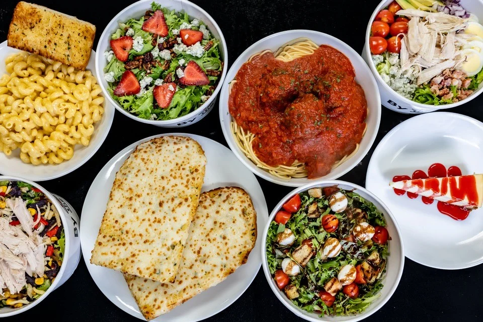 Italian spaghetti and meatballs with fresh salads and garlic bread