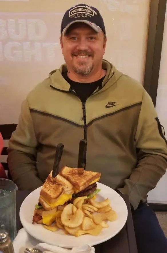 Hearty American cheeseburger with fries in a casual dining setting