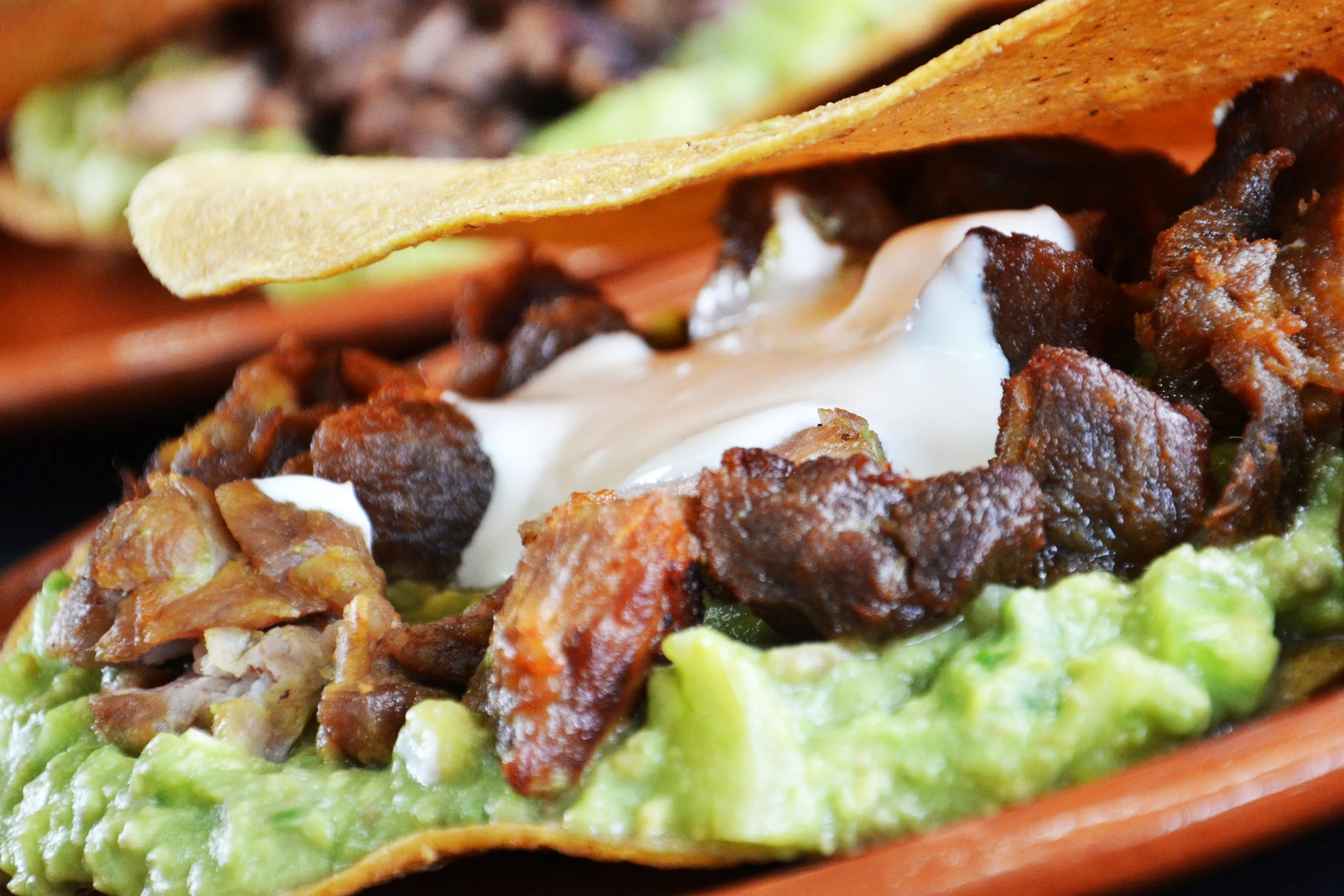 Delicious Mexican tacos with guacamole and meat