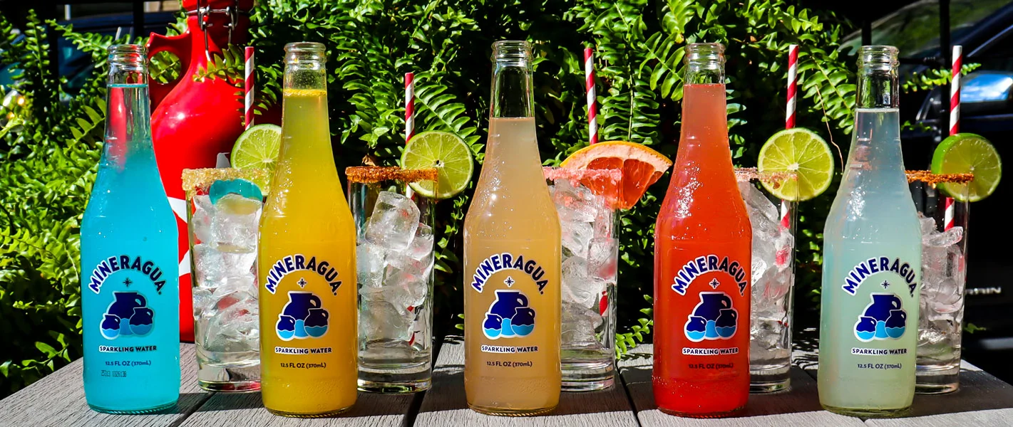 Colorful sparkling water bottles in a vibrant outdoor setting