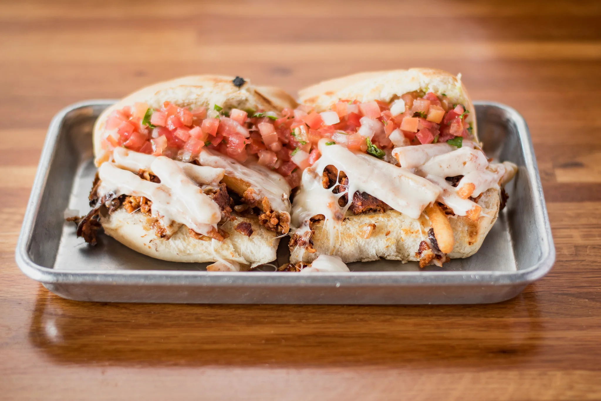 Delicious Mexican torta with grilled meat and fresh salsa