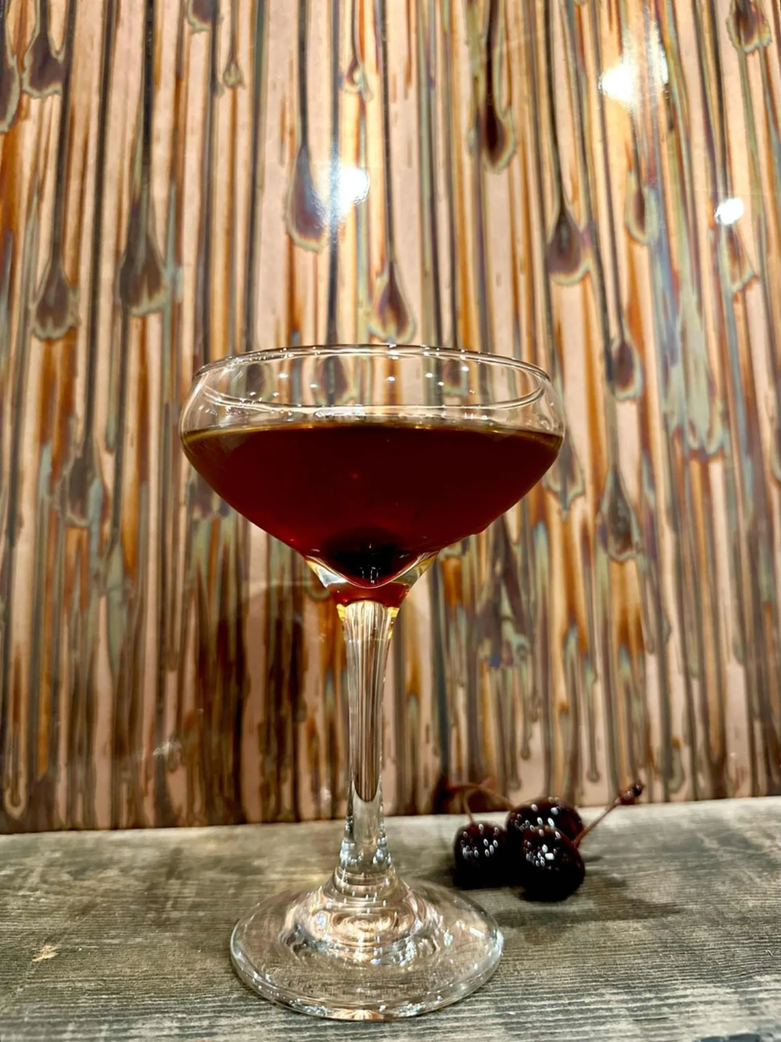 Classic Manhattan cocktail garnished with a cherry