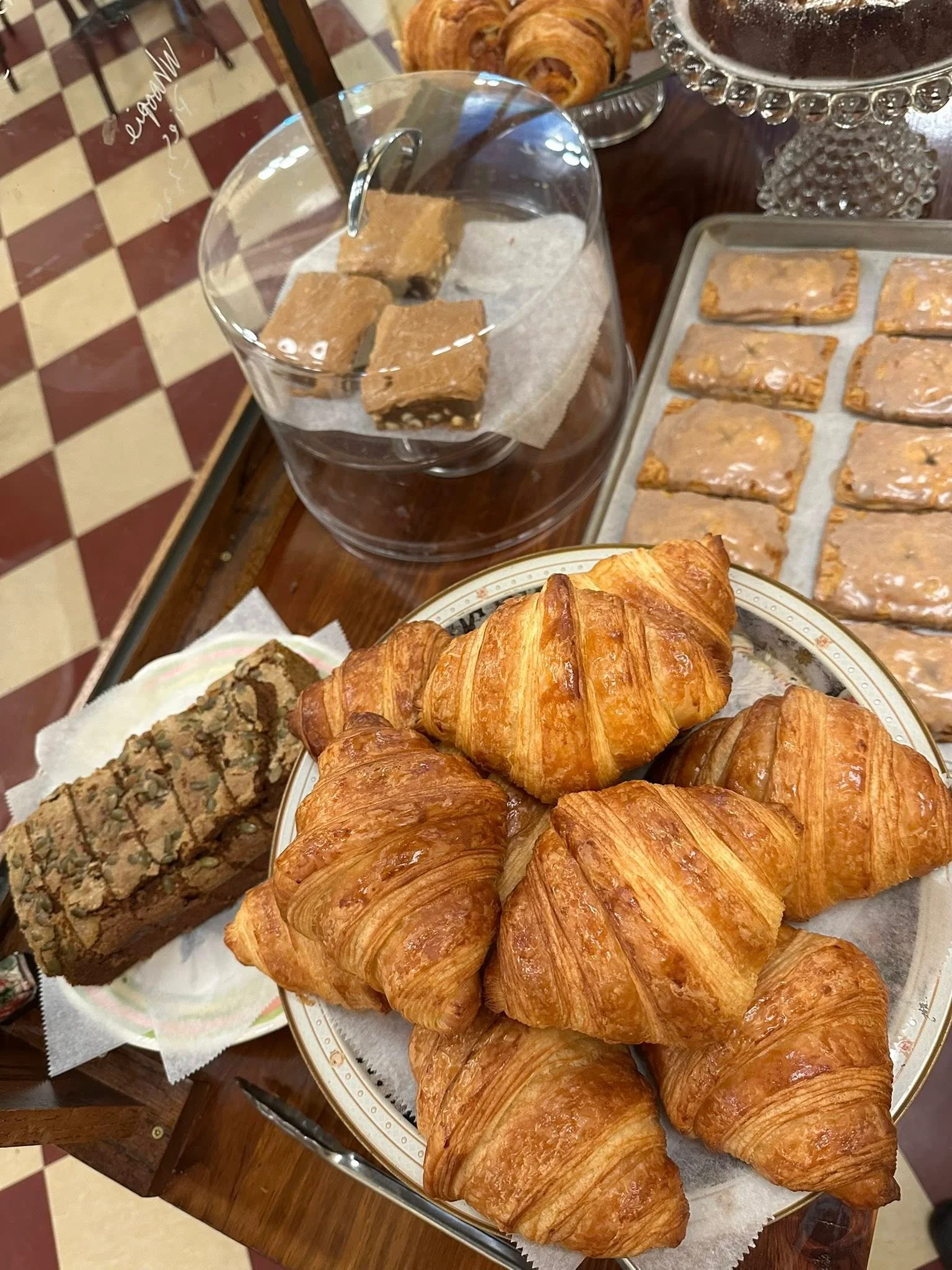Freshly baked croissants and pastries in a bakery display