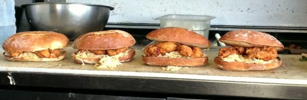 Crispy fried chicken sandwiches on a kitchen counter