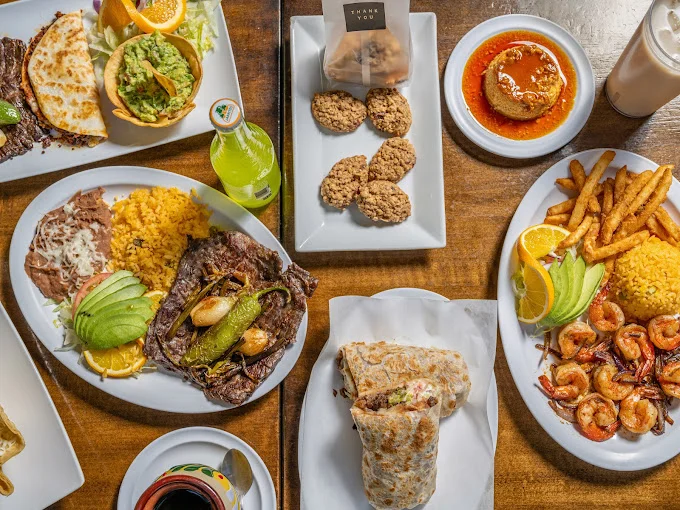 Delicious Mexican feast with carne asada, shrimp, and burrito