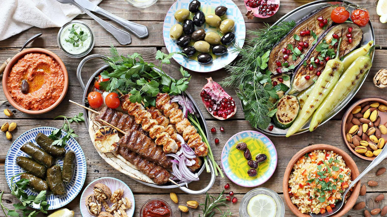 A colorful Mediterranean meal featuring fresh vegetables and grains.