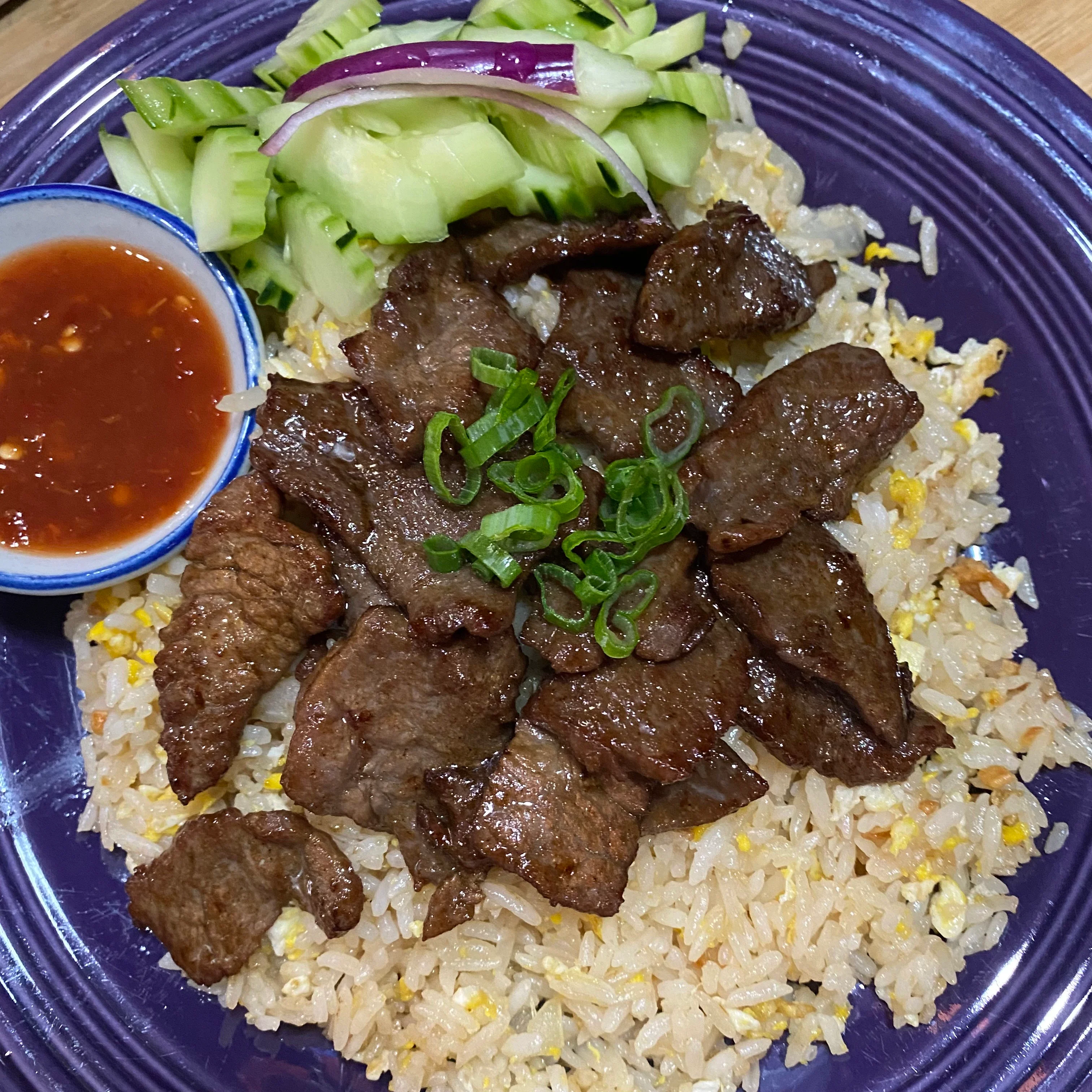 Vietnamese beef fried rice with fresh vegetables and dipping sauce