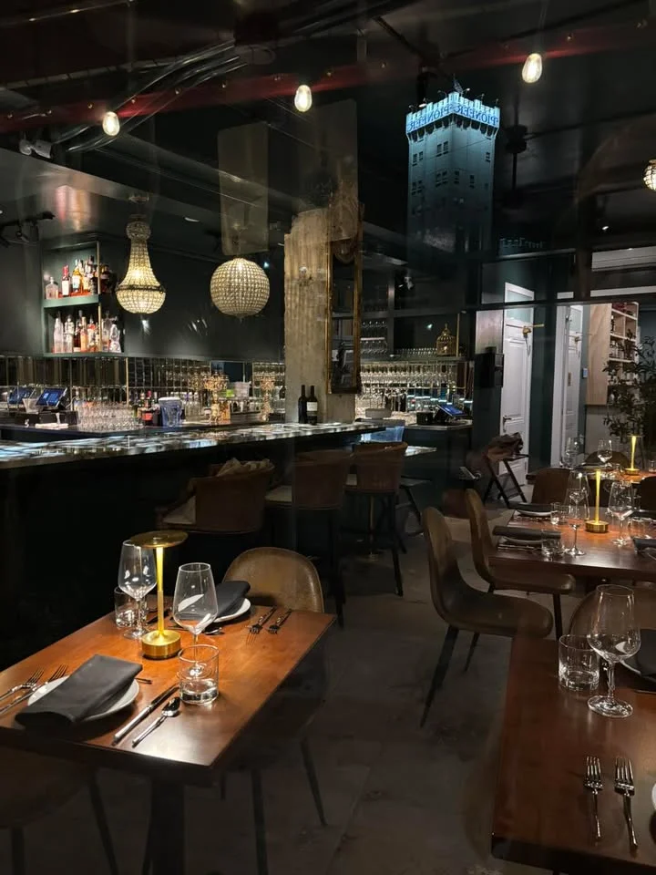 Elegant restaurant interior with bar and city view