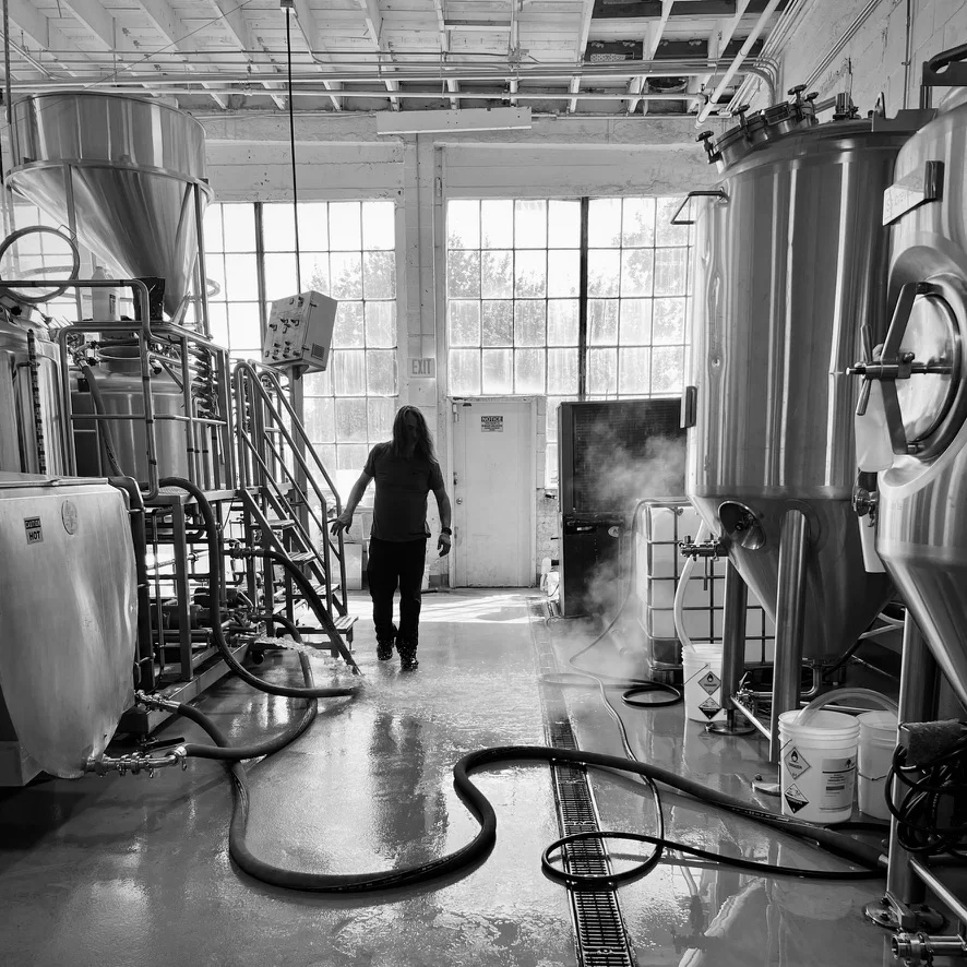 Silhouette of brewer walking in brewery