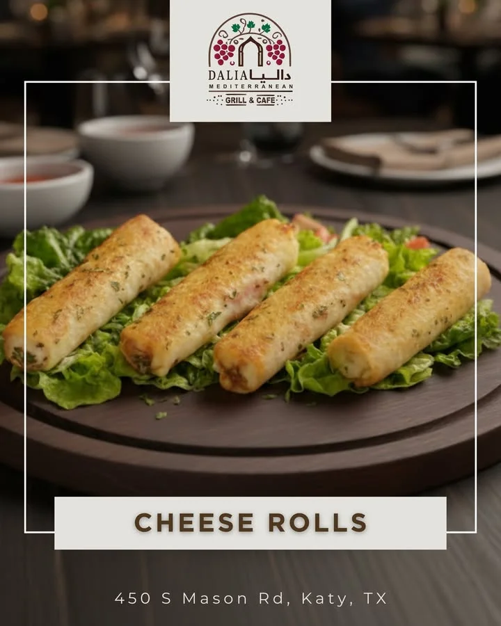 A serving of cheese rolls arranged on a wooden platter, placed on a bed of fresh lettuce.