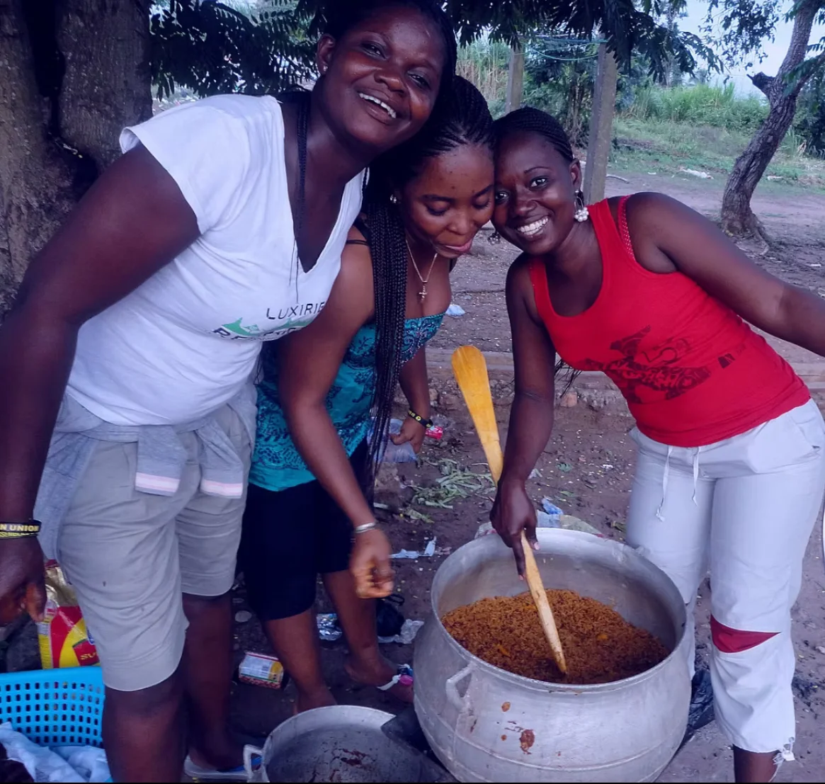 Ghanaian Women Cooking Jollof Rice