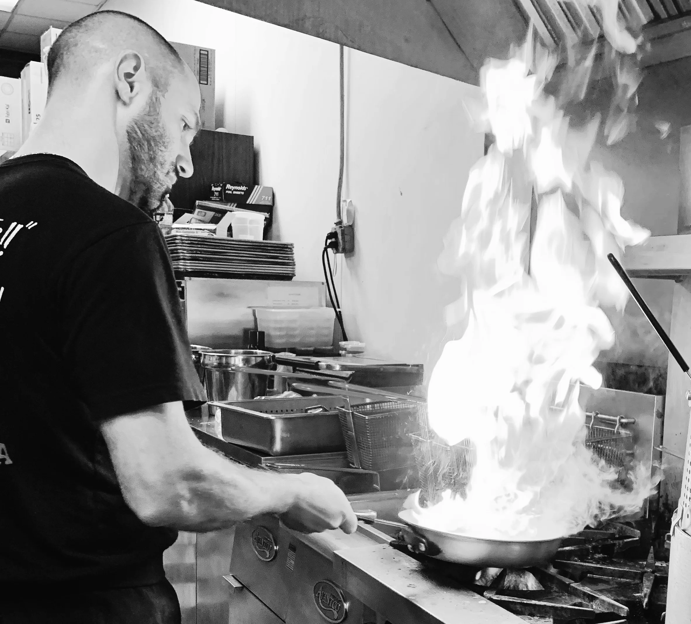A restaurant chef preparing a dish