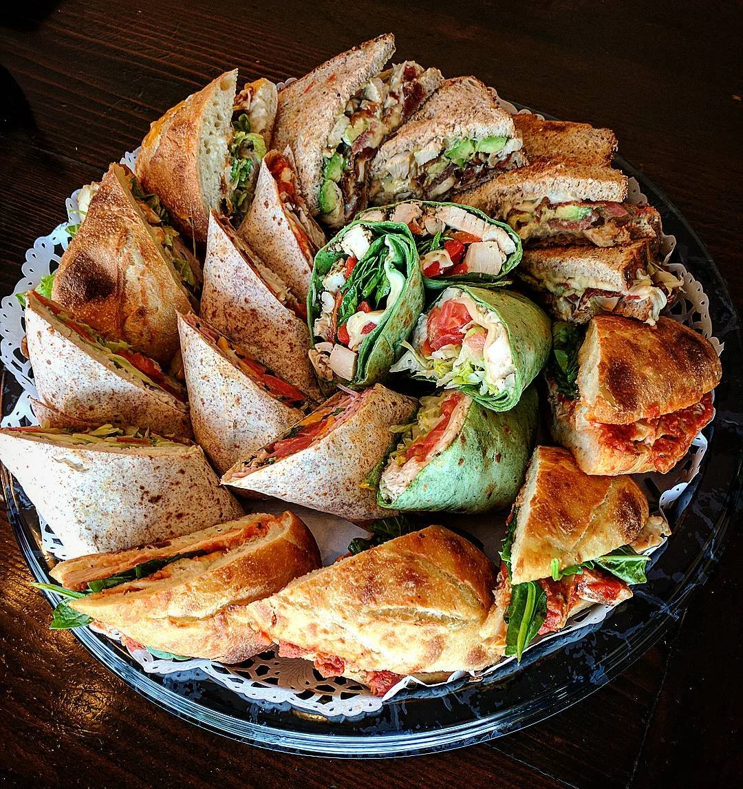 Assorted sandwich platter featuring wraps and paninis