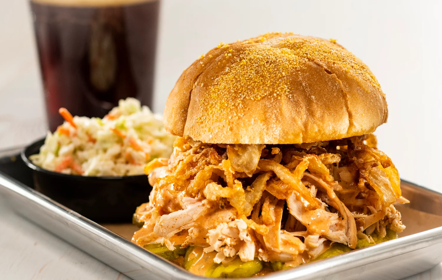Pulled chicken sandwich with crispy onions