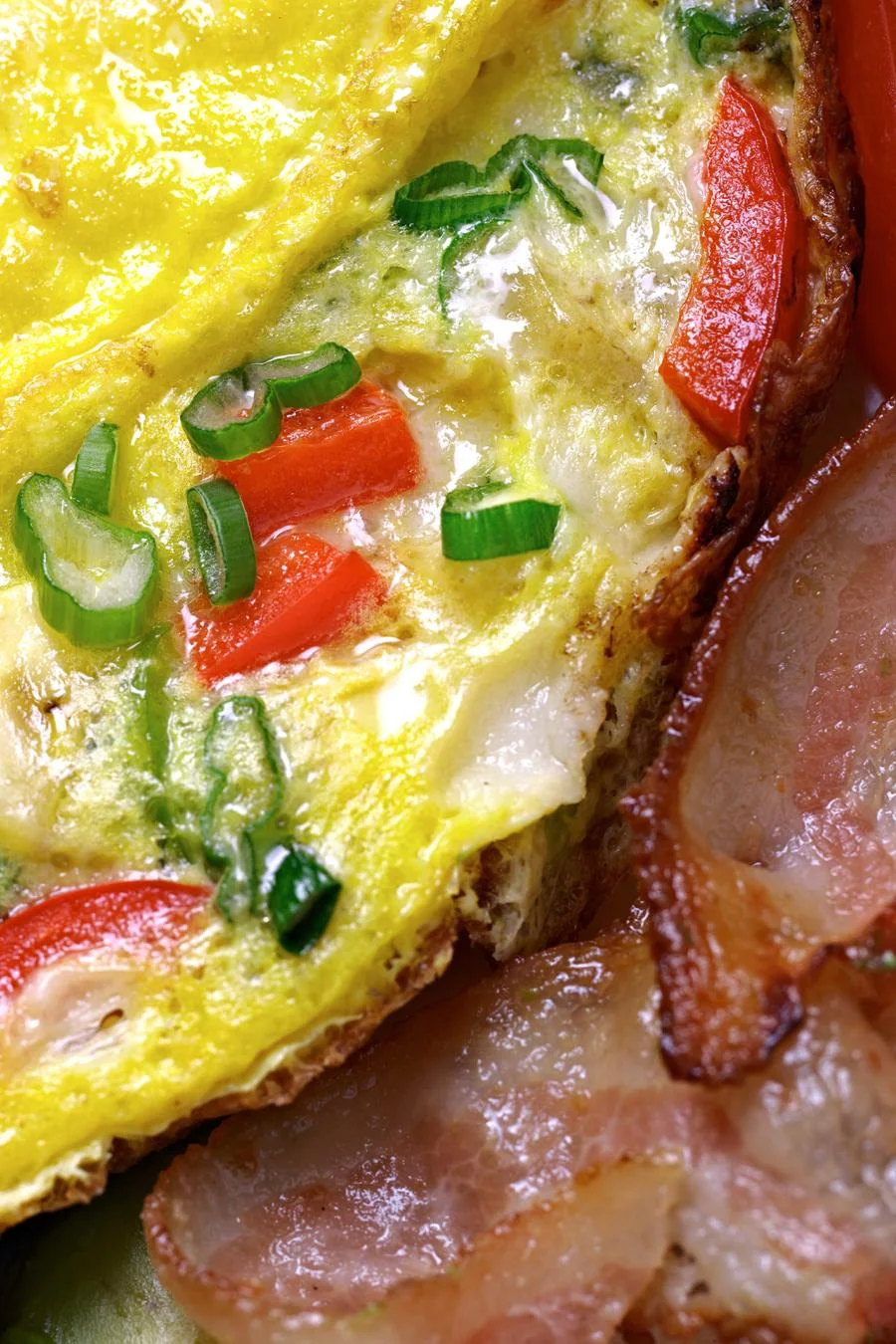 Fluffy Spanish omelette with bacon on the side