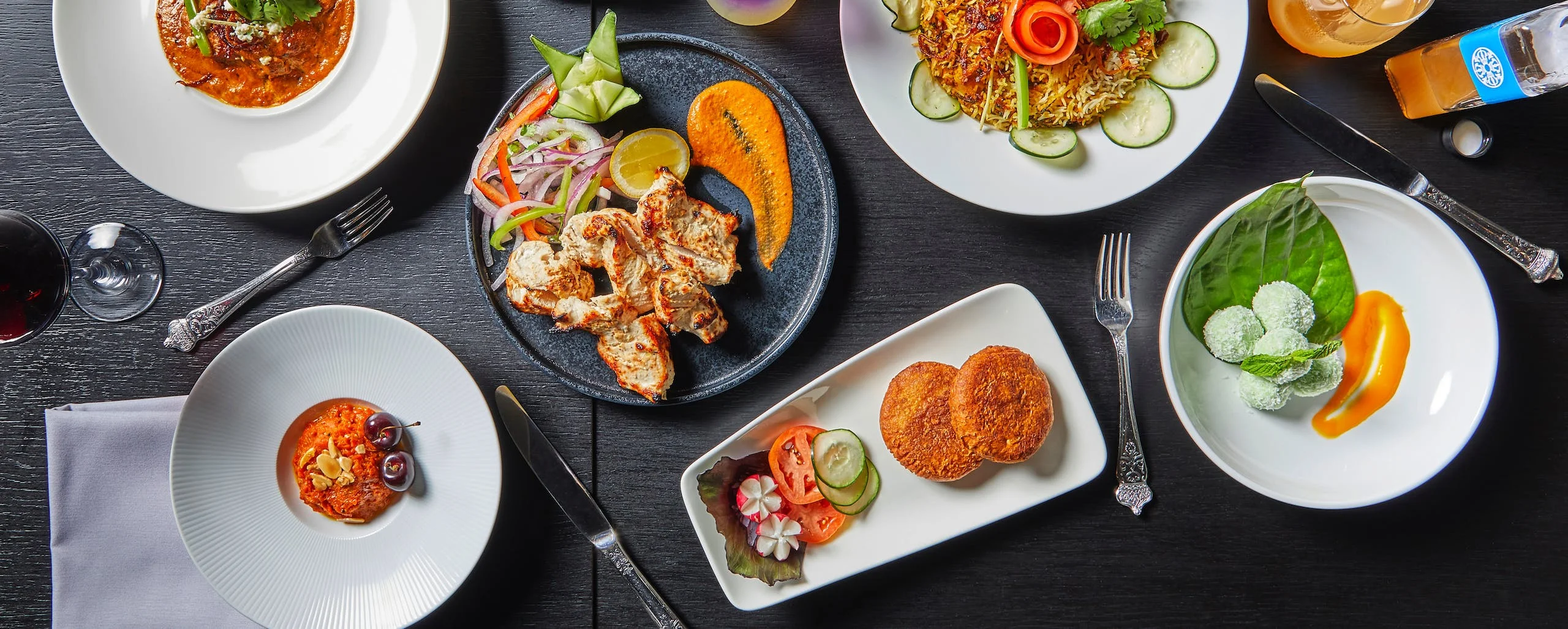 Assorted Indian dishes including chicken tikka and biryani