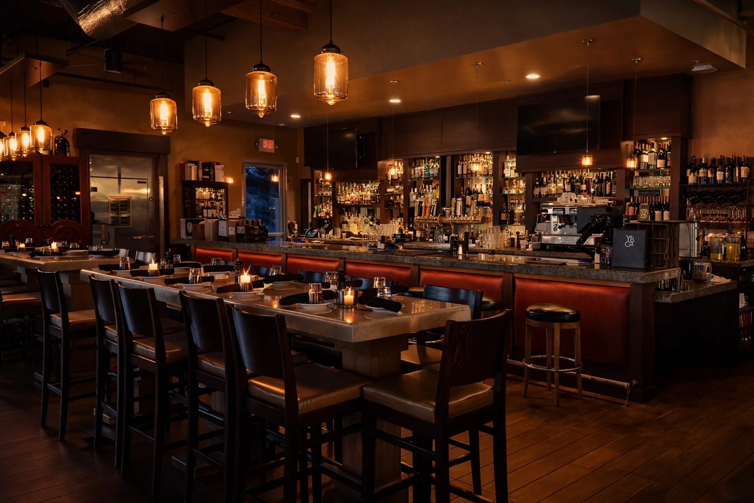 Cozy restaurant interior with warm lighting and a modern bar