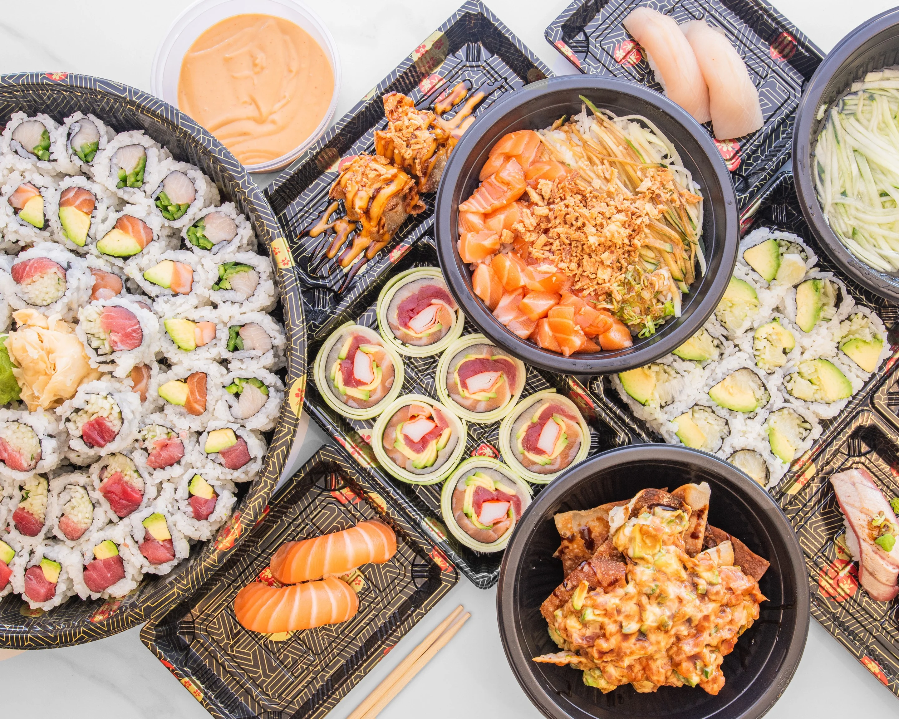 Assorted sushi platter featuring rolls and sashimi
