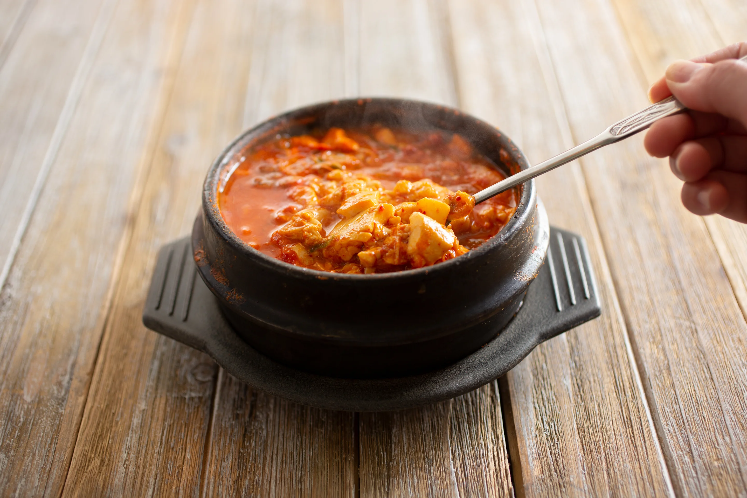 Korean kimchi jjigae in a stone pot