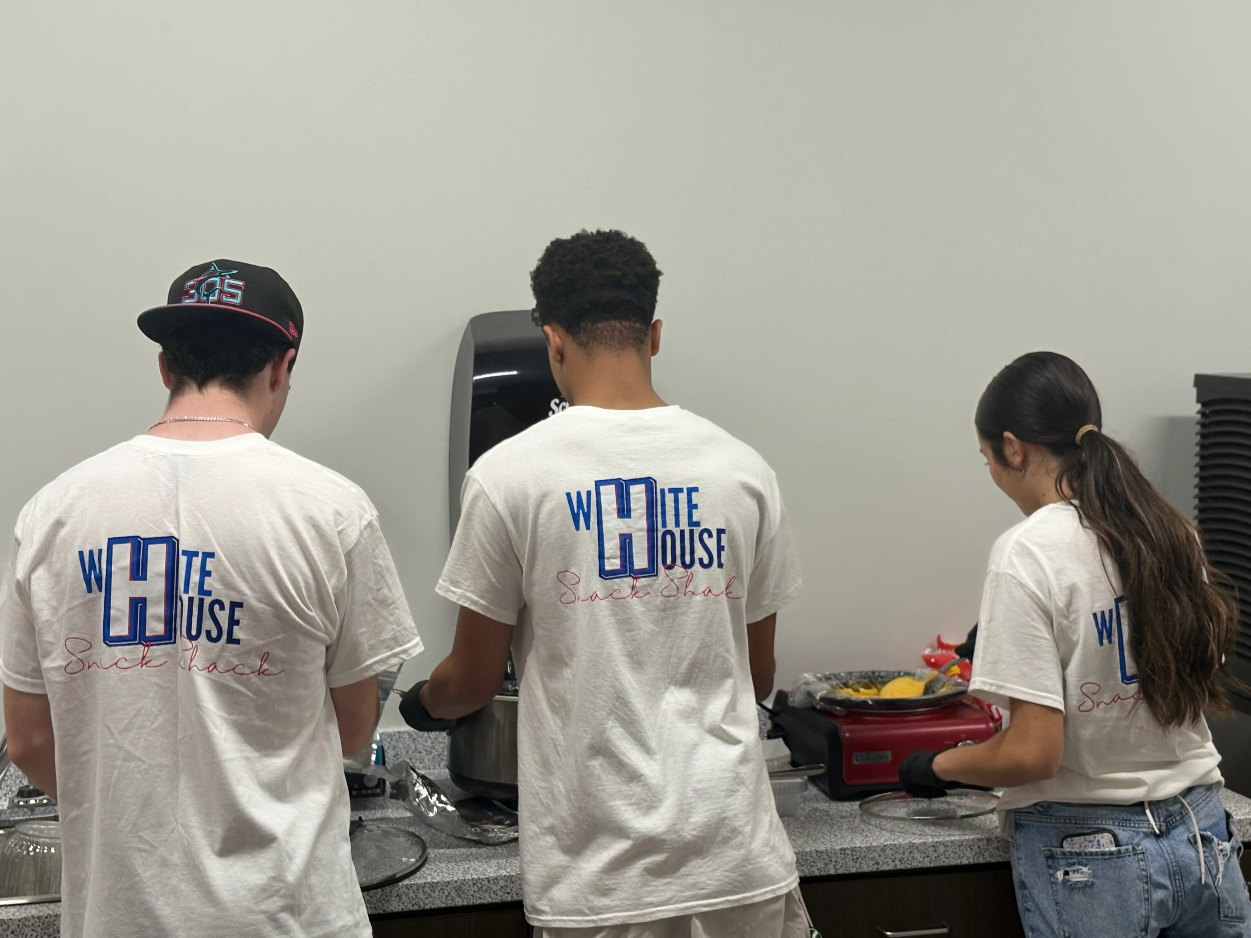 Staff preparing food at White House Snack Shack