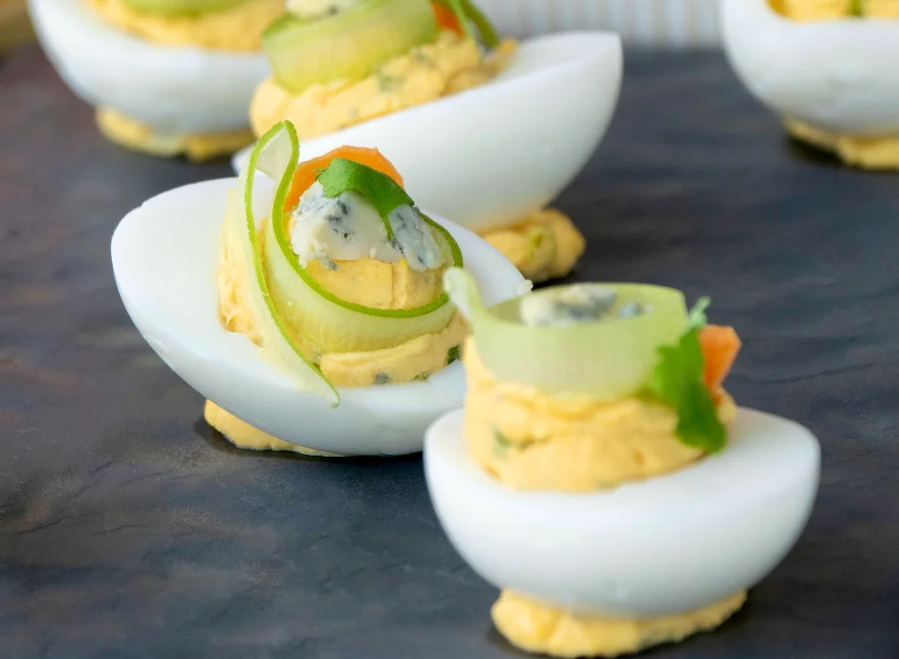 Gourmet deviled eggs with fresh herbs and toppings