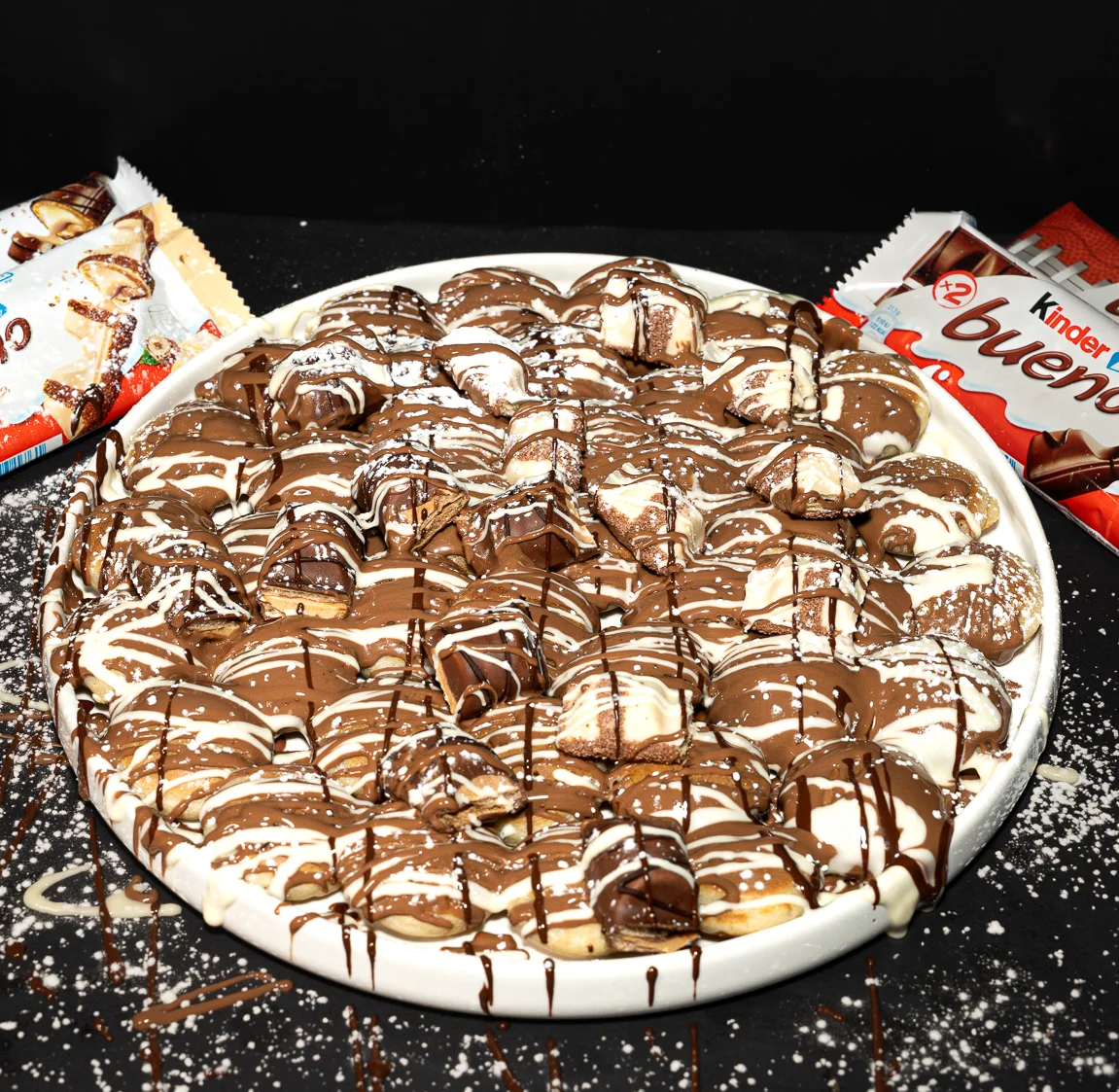 Nuts and honey and cream over a fruit cup