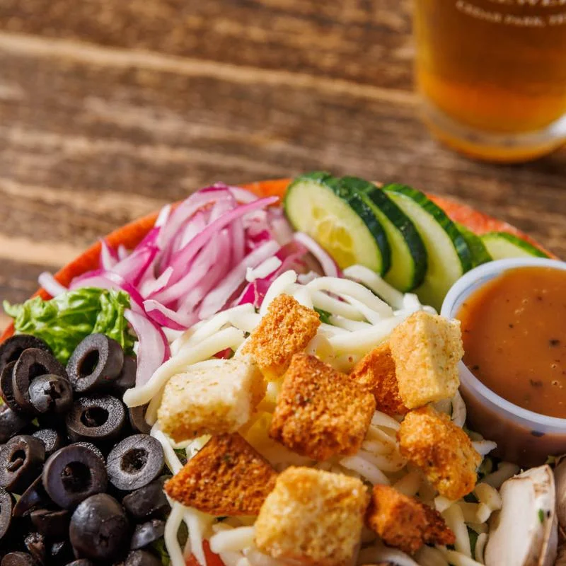 A beautifully arranged table with various dishes and drinks in a restaurant setting.